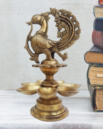 brass peacock diya